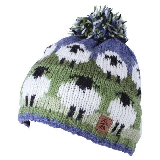 A knitted beanie hat with sheep design and a pompom