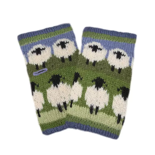 A pair of knitted handwarmers in blue and green, featuring two rows of white sheep