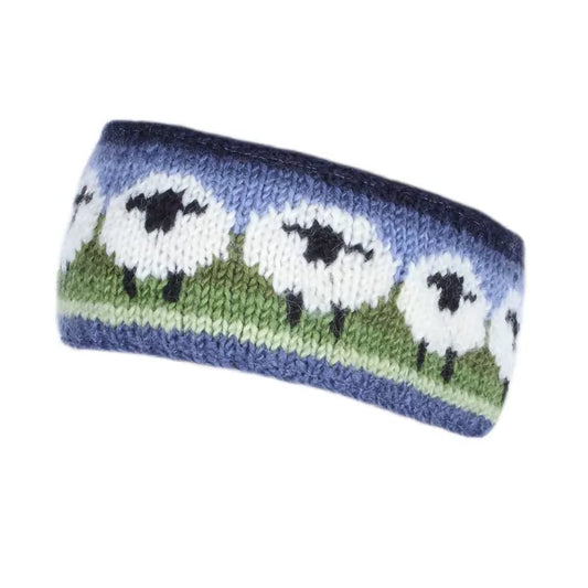 A knitted headband in green and blue with a row of white sheep