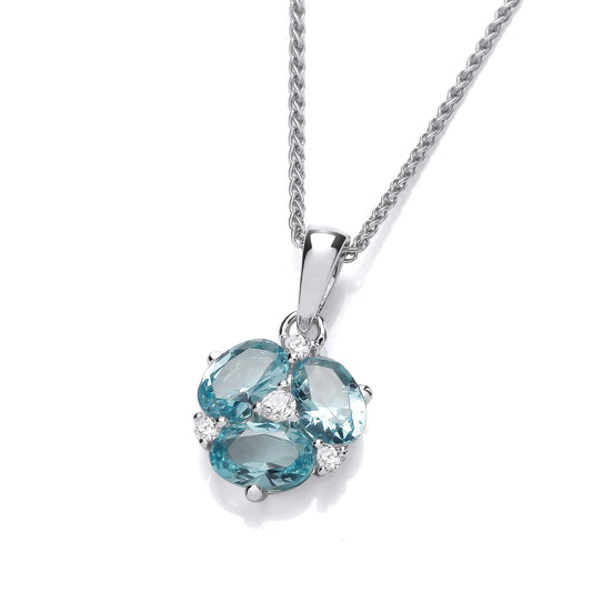 A pendant with oval cut blue CZ stones in the shape of a lily flower