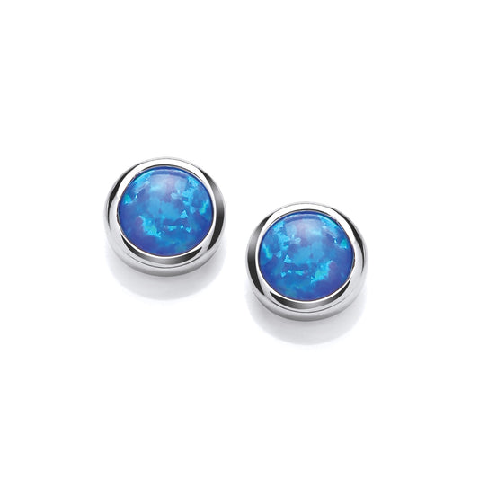 A pair of simple round silver studs with blue faux opal stone centres