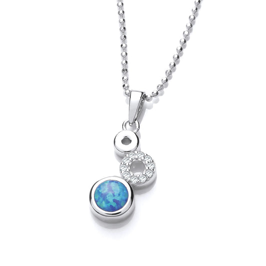 A pendant featuring three silver circles with cubic zirconia and blue opalique stones