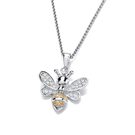 A silver bee pendant with yellow and white CZ stones