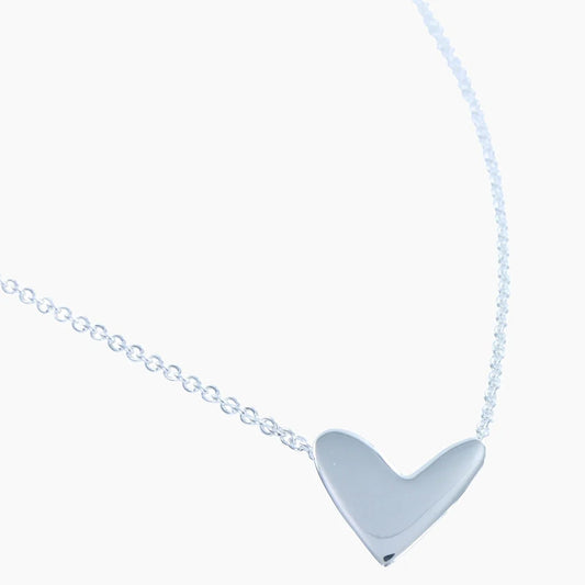A stretched heart design polished silver pendant on a chain
