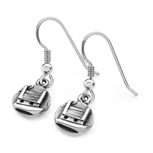 A pair of silver drops featuring round coins with raised little cottage houses and textured details