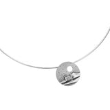 A necklet featuring a round coin pendant with a cottage in a windy scene and cutout moon