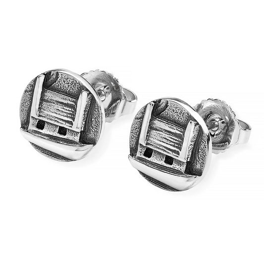 A pair of silver coin shaped stud earrings featuring little cottage houses and textured details
