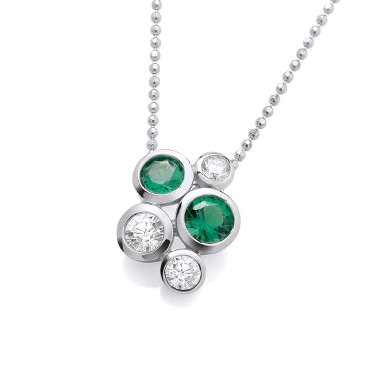 A silver pendant featuring a cluster of round CZ stones in emerald green and white