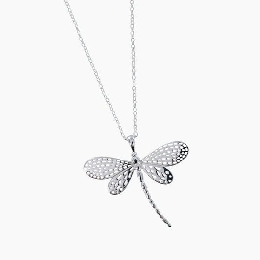 A silver dragonfly pendant with detailed filigree wings on a silver chain