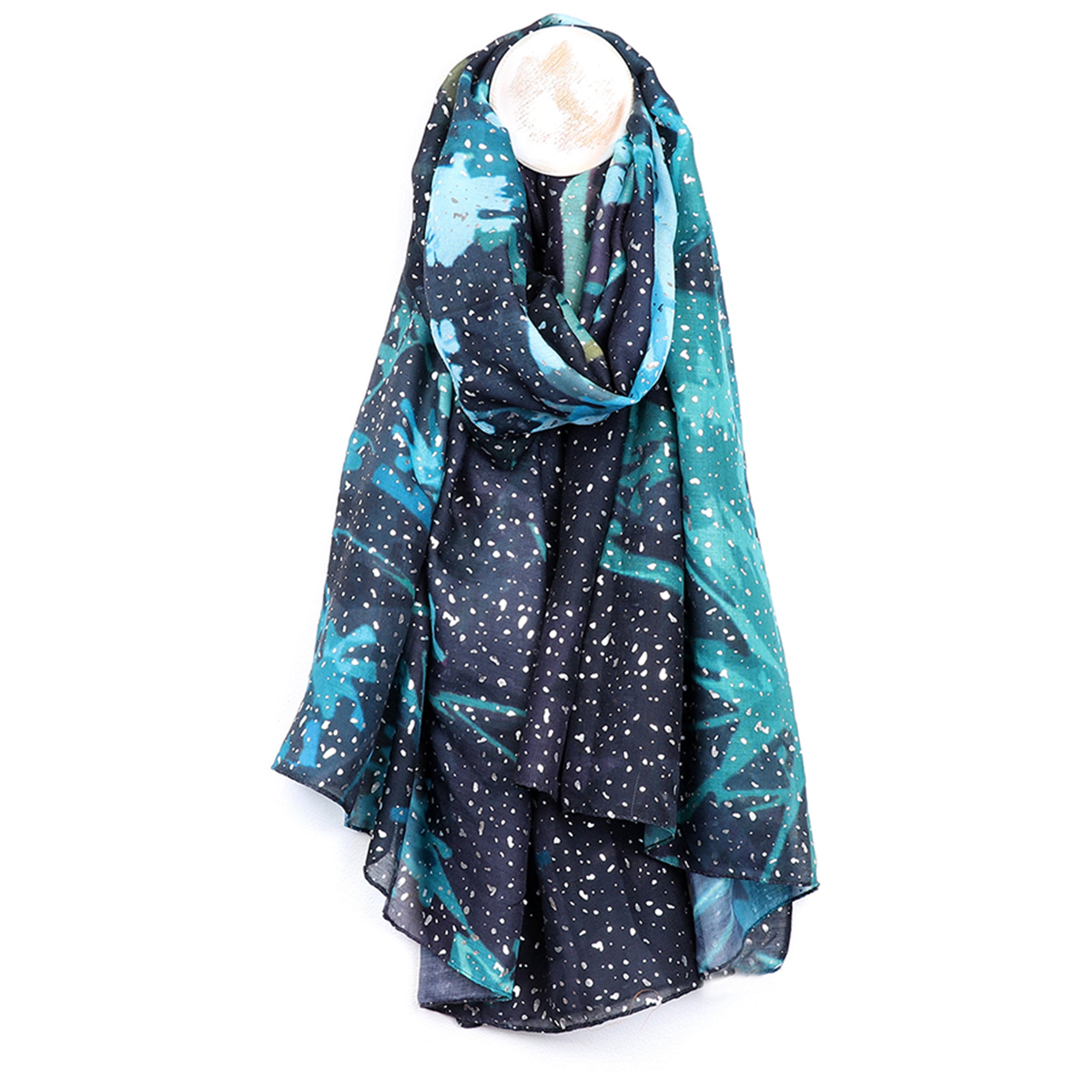 An aqua floral scarf with silver foil spot details on navy background