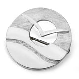 A round silver brooch featuring a flying seabird in front of a cut out sun over abstract waves