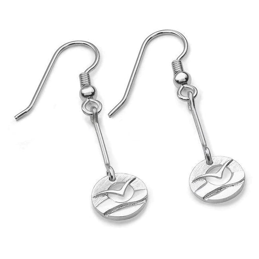 A pair of silver drops featuring a bar with round links with a flying sea bird in front of a cutout sun over water