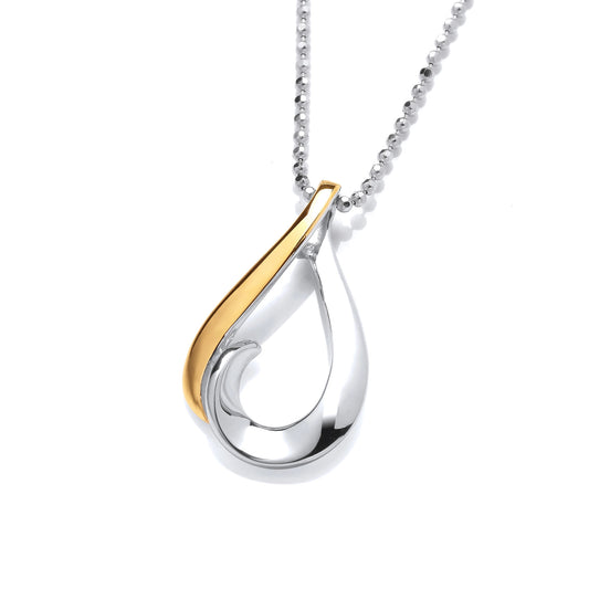 A silver swirling teardrop pendant with gold detail