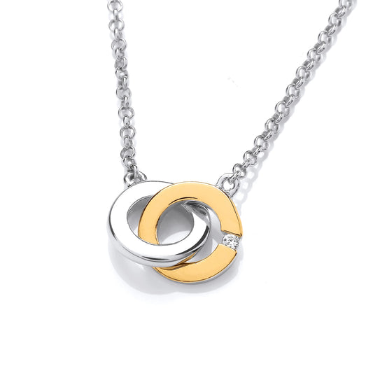 A silver & gold necklace featuring two linked circles with CZ detail