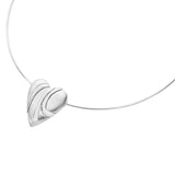 A silver neck wire with a matt heart pendant featuring 3 shiny bevelled organic stripe details