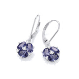A pair of earrings with oval cut purple CZ stones in the shape of lily flowers