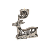 A silver metal tealight holder shaped like a sitting stag/reindeer