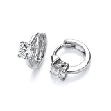 A pair of simple silver huggie hoop earrings with a single solitaire CZ stone