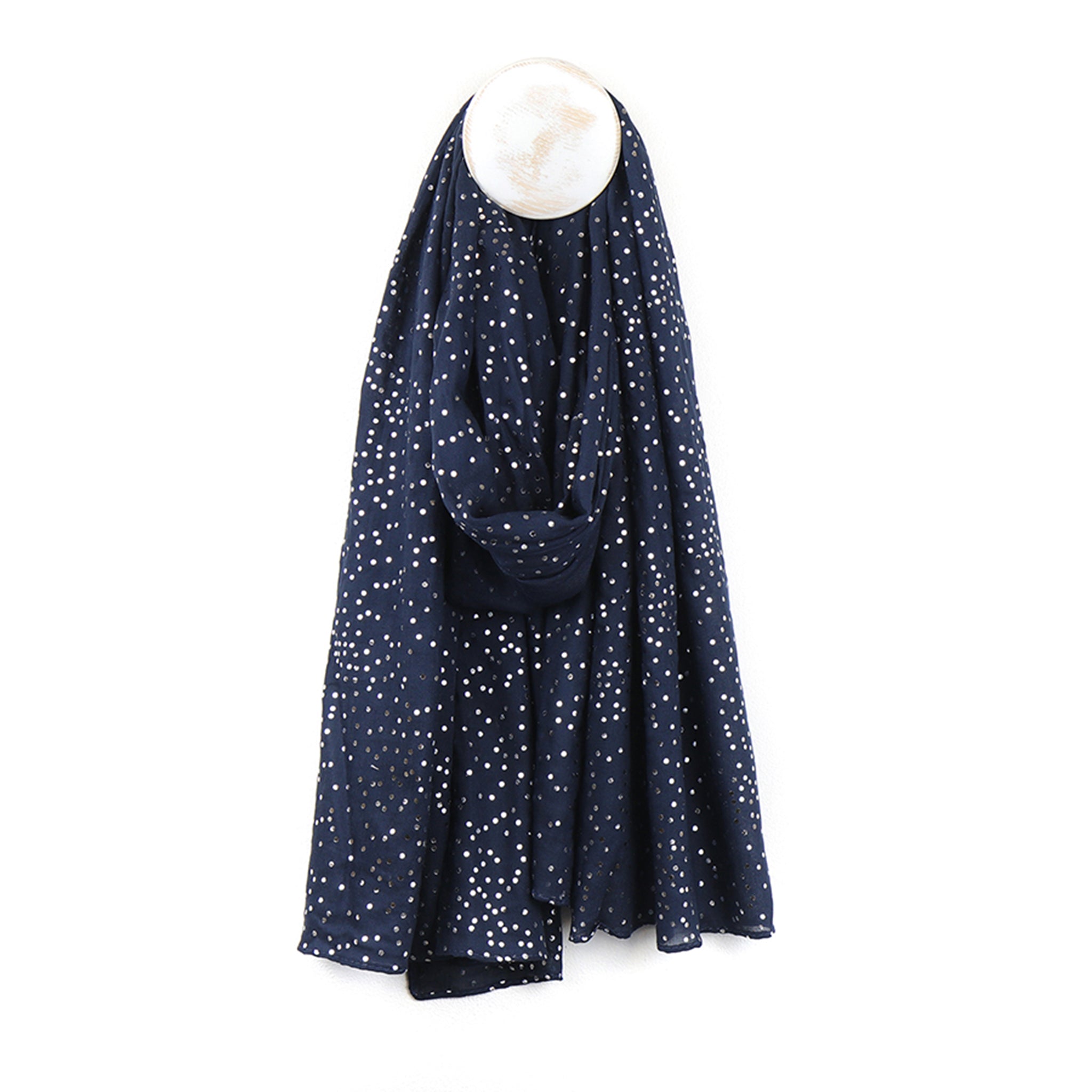 A navy blue scarf with silver foil speckle pattern