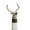 A wine pourer with silver stag head on a bottle