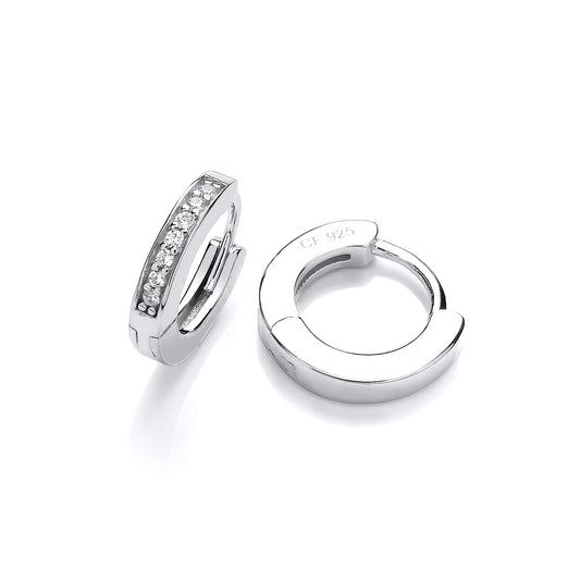 A pair of silver huggie hoop earrings set with cubic zirconia stones