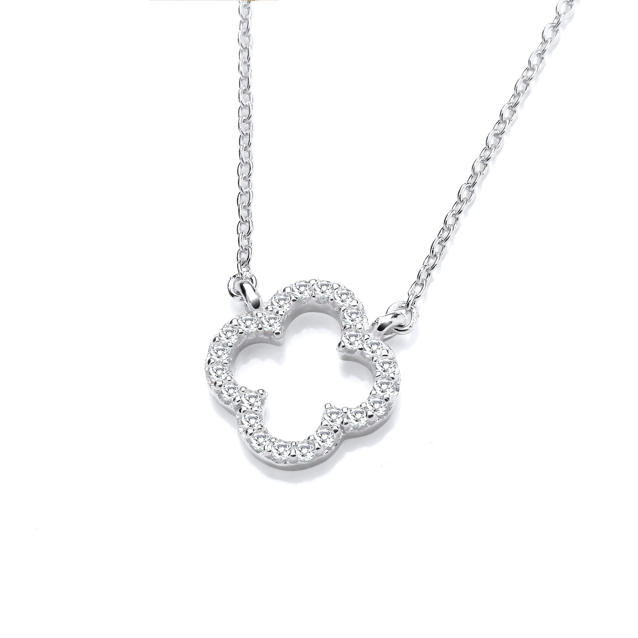 An open clover shaped silver necklace with cubic zirconia stones