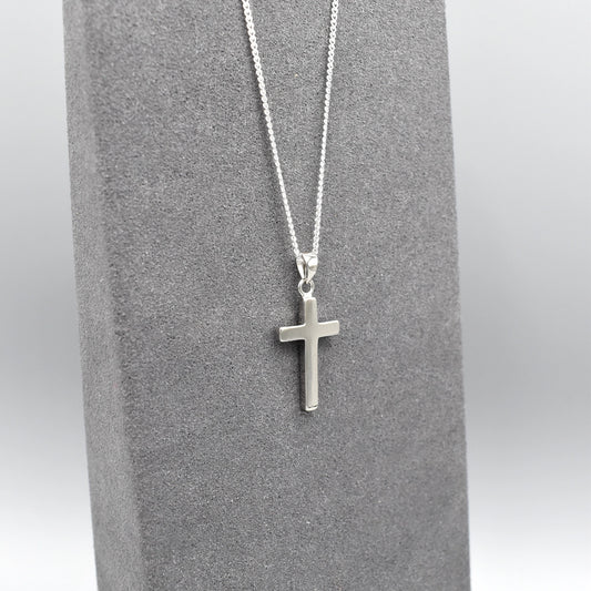 Simple silver cross pendant on silver chain