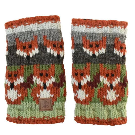 A pair of knitted handwarmers in green featuring rows of orange foxes