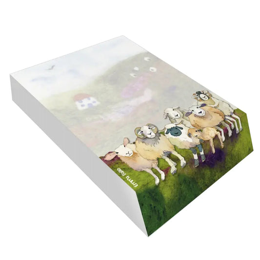 A slant block notepad featuring print of different breeds of sheep on a felted landscape background