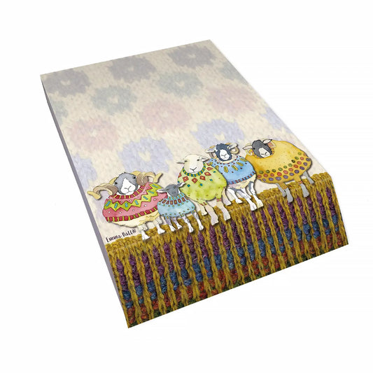 A slant block notepad featuring print of sheep in knitted sweaters