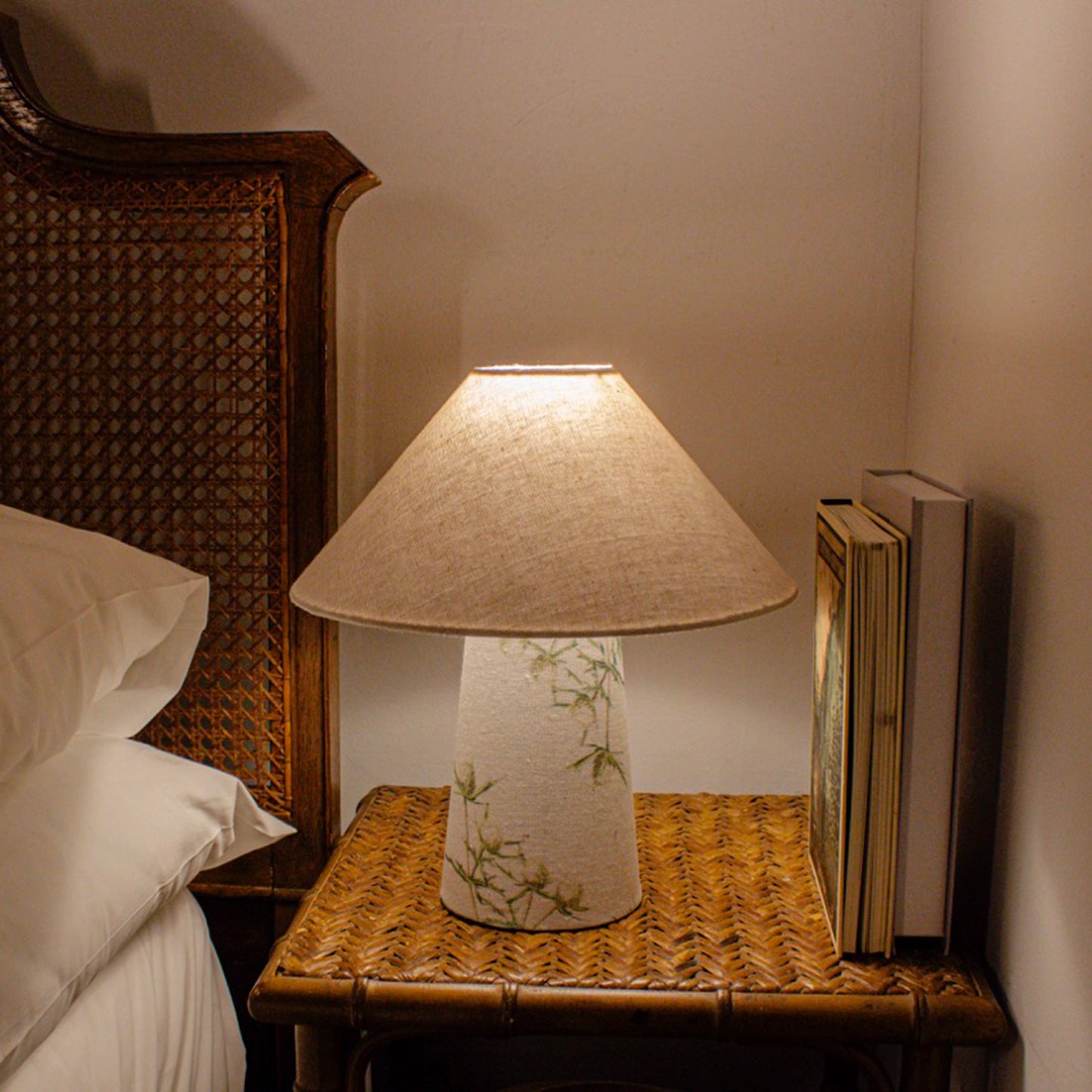 A small fabric table lamp with shade and a thistle design on the conical base lifestyle