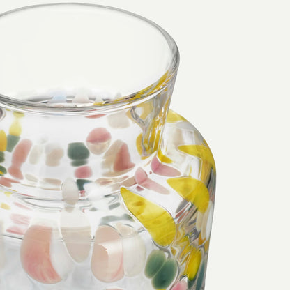 Tall glass vase with pastel and white pebble details top detail