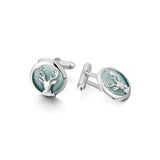 Round silver cufflinks with stag's head design in the centre and a moss green enamel with T-bar clasp