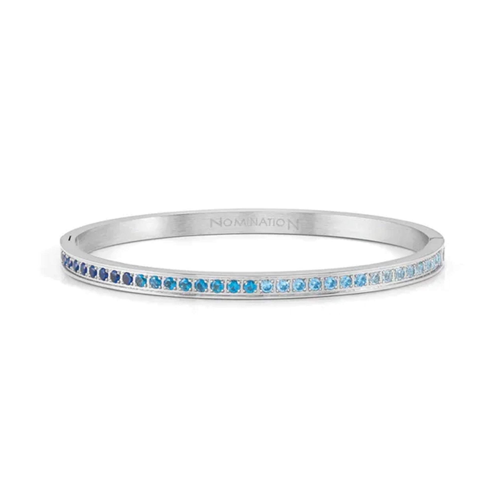 A stainless steel bangle with gradient blue CZ strip