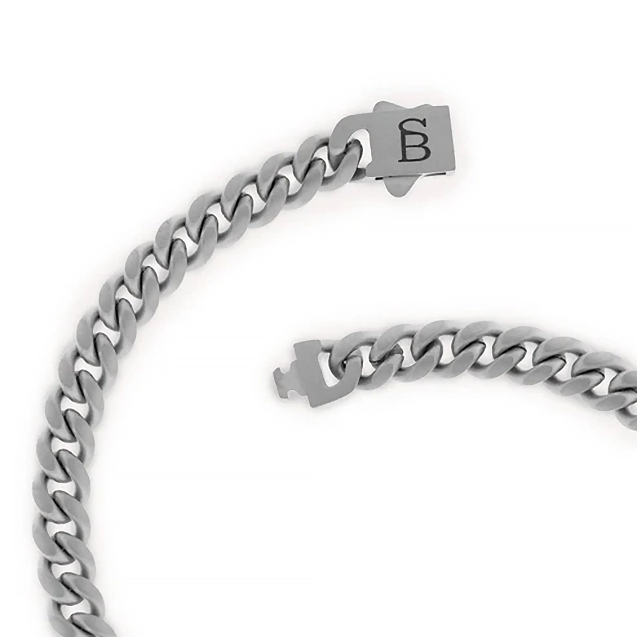 A silver stainless steel chain bracelet with monogramed clasp