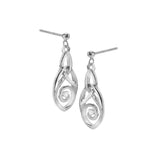 A pair of silver drop earrings featuring trinity knots that turn into spirals