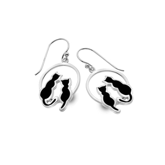 A silver pair of drop earrings featuring round hoops with two sitting black cats and hook fittings
