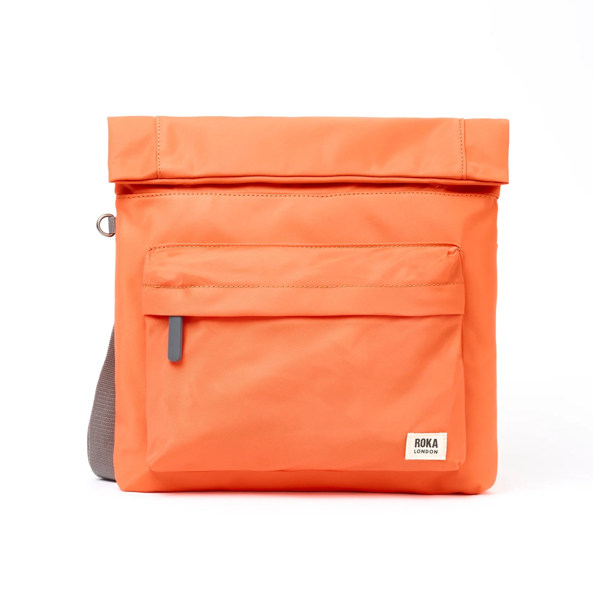 A square orange nylon bag with grey cotton strap and roll top