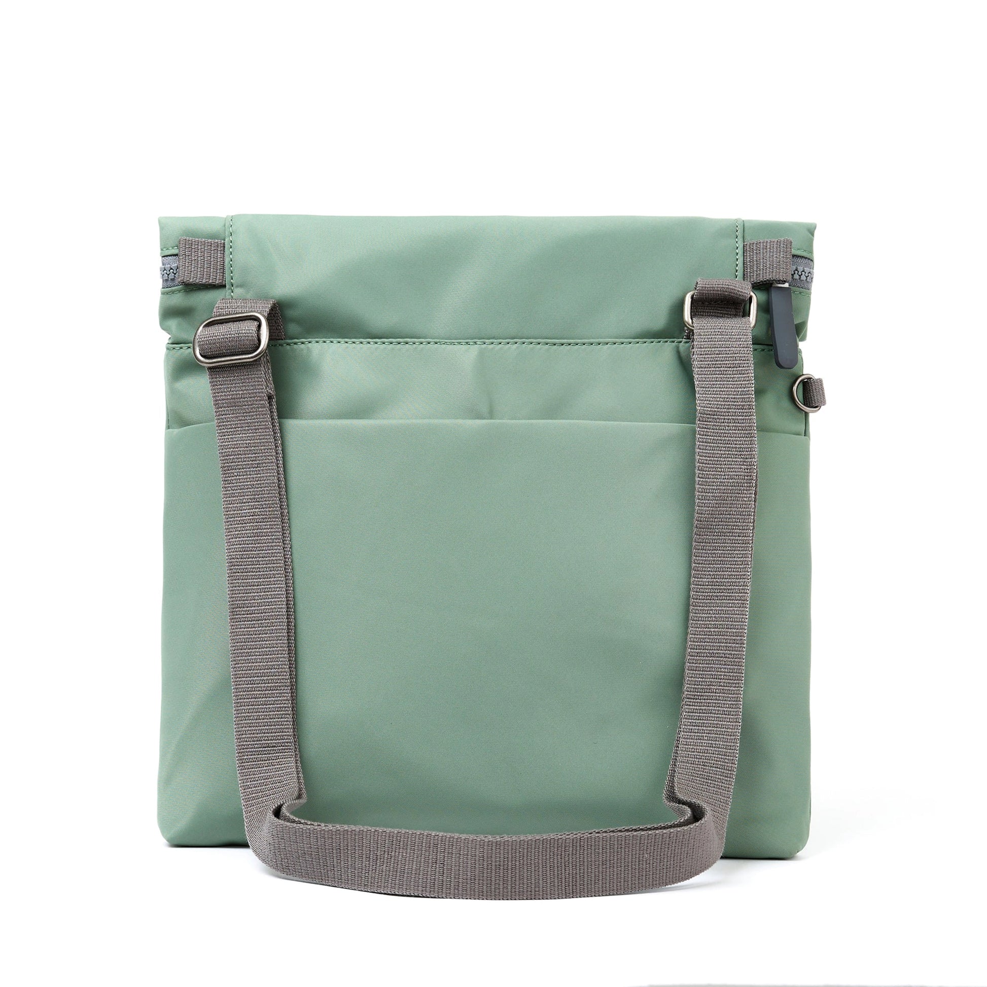 A square mint green nylon bag with grey cotton strap and roll top back