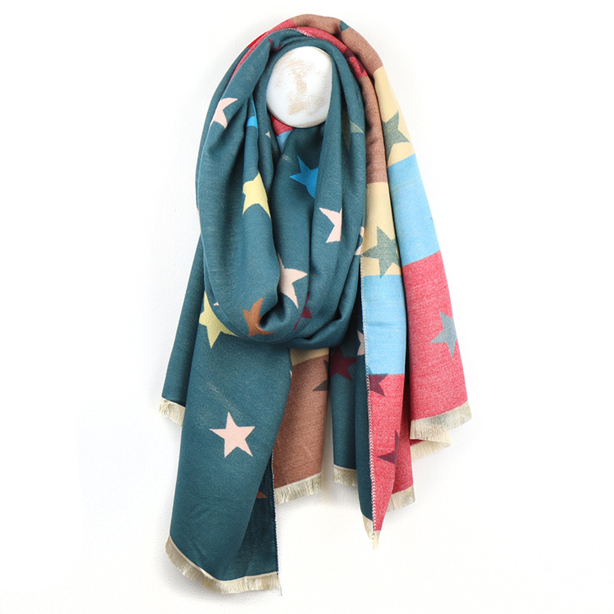 Reversible scarf in teal blue with a multicolour stripe reverse side and star pattern