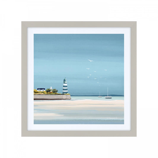 Square framed print of a seaside scene with blue sky and water, boats on the horizon and a lighthouse.