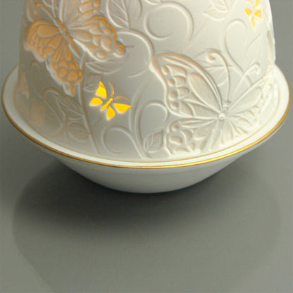White porcelain tall dome candle holder with engraved butterflies and gold rimmed plate detail