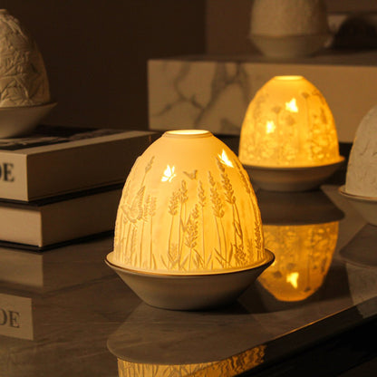 White porcelain tall dome candle holder with engraved lavender and gold rimmed plate lifestyle