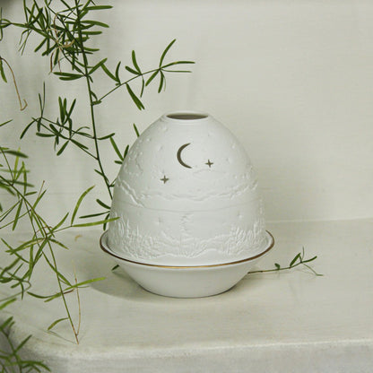 White porcelain tall dome candle holder with engraved starry night scene and gold rimmed plate