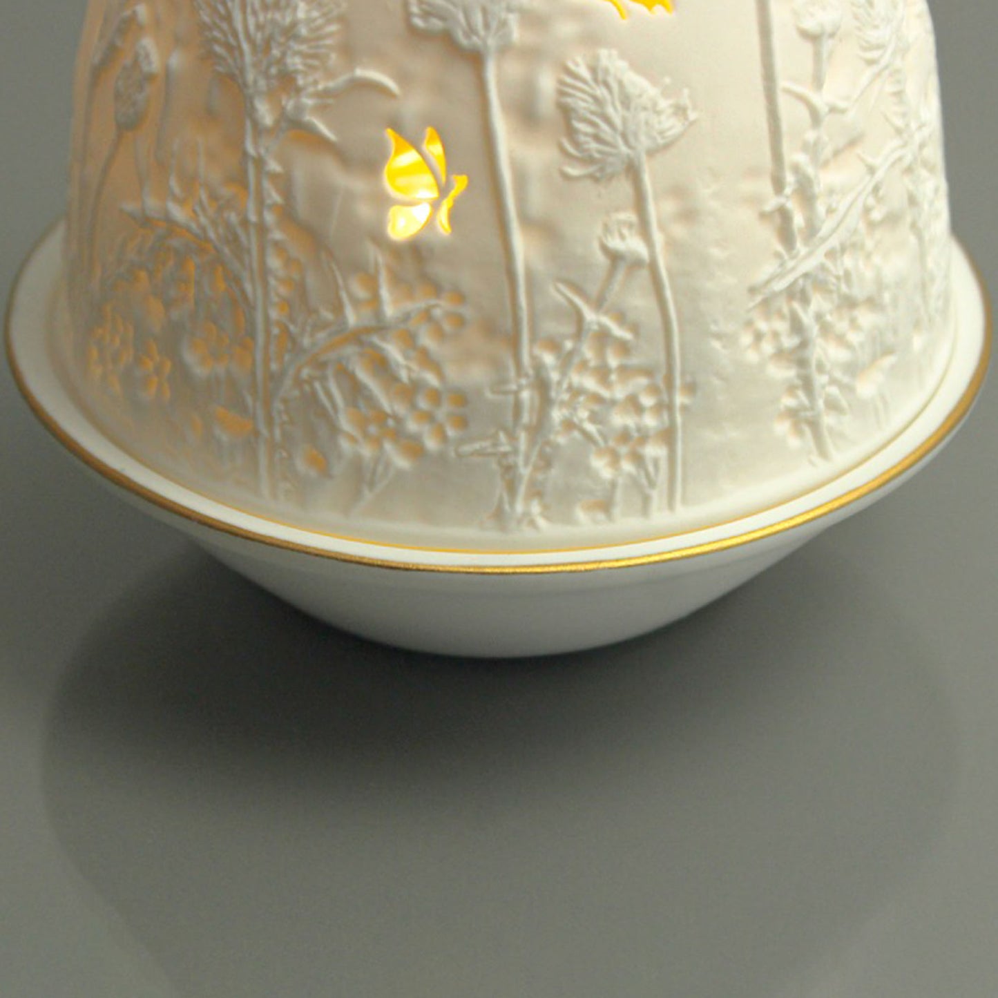 White porcelain tall dome candle holder with engraved thistle scene and gold rimmed plate detail