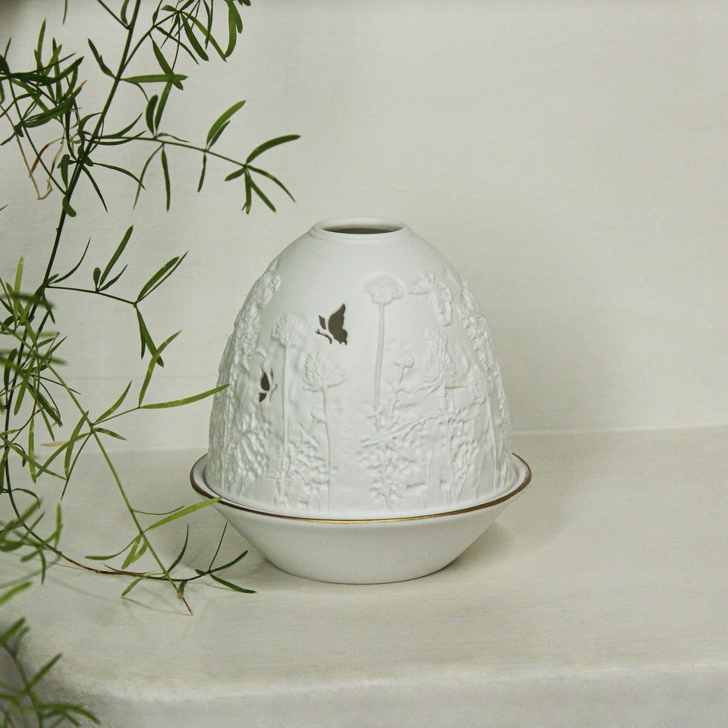 White porcelain tall dome candle holder with engraved thistle scene and gold rimmed plate