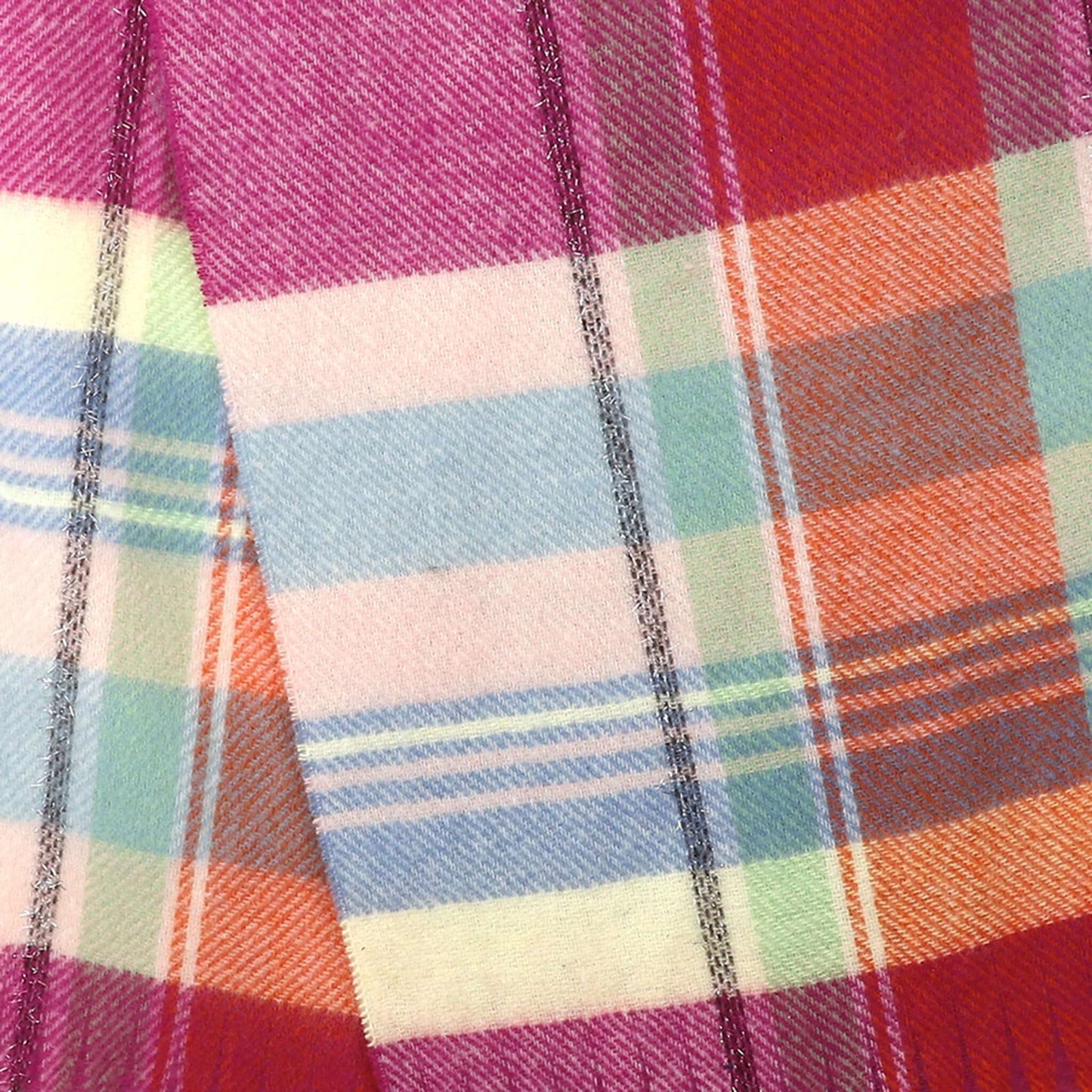 A tartan check scarf in pastel colours and brown with tassel fringe pattern detail