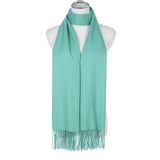 A long light green scarf with tassels