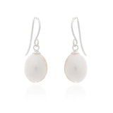 A pair of drop earrings with teardrop shaped white pearls and silver hooks