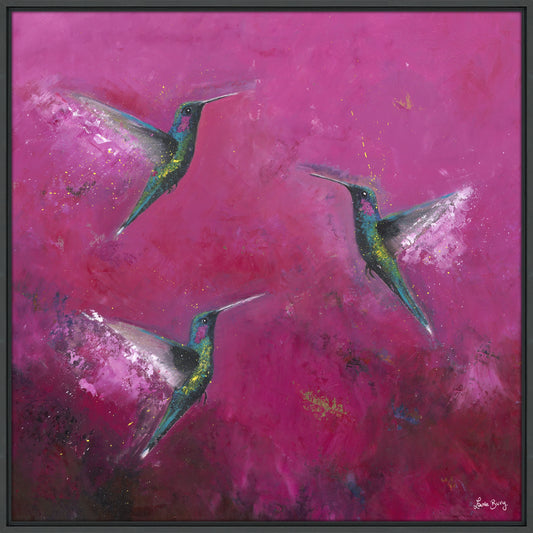 A large square print of a bright pink painting featuring three flying green hummindbirds